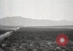 Image of Holt tractor pulling trucks through wet sand Nevada United States USA, 1919, second 12 stock footage video 65675025558