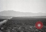 Image of Holt tractor pulling trucks through wet sand Nevada United States USA, 1919, second 13 stock footage video 65675025558