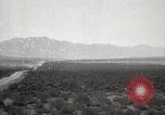 Image of Holt tractor pulling trucks through wet sand Nevada United States USA, 1919, second 14 stock footage video 65675025558