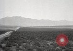 Image of Holt tractor pulling trucks through wet sand Nevada United States USA, 1919, second 15 stock footage video 65675025558