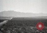 Image of Holt tractor pulling trucks through wet sand Nevada United States USA, 1919, second 16 stock footage video 65675025558