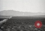 Image of Holt tractor pulling trucks through wet sand Nevada United States USA, 1919, second 17 stock footage video 65675025558