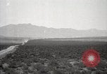 Image of Holt tractor pulling trucks through wet sand Nevada United States USA, 1919, second 18 stock footage video 65675025558