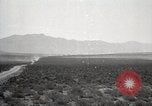 Image of Holt tractor pulling trucks through wet sand Nevada United States USA, 1919, second 19 stock footage video 65675025558