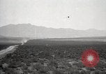 Image of Holt tractor pulling trucks through wet sand Nevada United States USA, 1919, second 20 stock footage video 65675025558