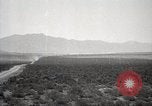 Image of Holt tractor pulling trucks through wet sand Nevada United States USA, 1919, second 21 stock footage video 65675025558