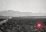 Image of Holt tractor pulling trucks through wet sand Nevada United States USA, 1919, second 22 stock footage video 65675025558