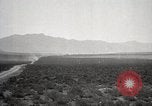 Image of Holt tractor pulling trucks through wet sand Nevada United States USA, 1919, second 24 stock footage video 65675025558