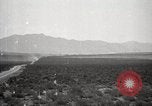 Image of Holt tractor pulling trucks through wet sand Nevada United States USA, 1919, second 25 stock footage video 65675025558