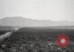Image of Holt tractor pulling trucks through wet sand Nevada United States USA, 1919, second 27 stock footage video 65675025558
