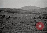 Image of Holt tractor pulling trucks through wet sand Nevada United States USA, 1919, second 54 stock footage video 65675025558