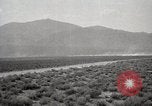 Image of Holt tractor pulling trucks through wet sand Nevada United States USA, 1919, second 60 stock footage video 65675025558