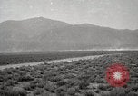 Image of Holt tractor pulling trucks through wet sand Nevada United States USA, 1919, second 61 stock footage video 65675025558