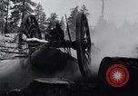 Image of large wheeled rig hauling cut logs United States USA, 1920, second 12 stock footage video 65675025658