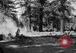 Image of large wheeled rig hauling cut logs United States USA, 1920, second 21 stock footage video 65675025658