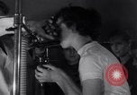Image of Professor checks a machine Oxford Ohio USA, 1935, second 6 stock footage video 65675025715