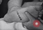 Standbild Tätowierung der Sozialversicherungsnummer Chicago Illinois USA, 1937, aus Sekunde 58 historischem Filmmaterial Videoclip 65675025727