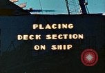 Image of Mobile cranes move ship's deck section at shipyard in World War California United States USA, 1942, second 1 stock footage video 65675025791