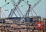 Image of Mobile cranes move ship's deck section at shipyard in World War California United States USA, 1942, second 31 stock footage video 65675025791