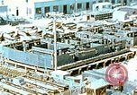 Image of Work being done on inverted deck house section of a Liberty ship  California United States USA, 1942, second 12 stock footage video 65675025793