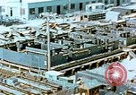 Image of Work being done on inverted deck house section of a Liberty ship  California United States USA, 1942, second 14 stock footage video 65675025793