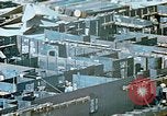 Image of Work being done on inverted deck house section of a Liberty ship  California United States USA, 1942, second 34 stock footage video 65675025793