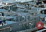 Image of Work being done on inverted deck house section of a Liberty ship  California United States USA, 1942, second 38 stock footage video 65675025793