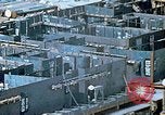Image of Work being done on inverted deck house section of a Liberty ship  California United States USA, 1942, second 39 stock footage video 65675025793