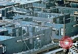 Image of Work being done on inverted deck house section of a Liberty ship  California United States USA, 1942, second 41 stock footage video 65675025793