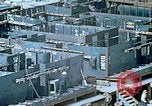 Image of Work being done on inverted deck house section of a Liberty ship  California United States USA, 1942, second 43 stock footage video 65675025793