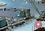 Image of Work being done on inverted deck house section of a Liberty ship  California United States USA, 1942, second 50 stock footage video 65675025793