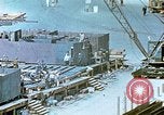 Image of Work being done on inverted deck house section of a Liberty ship  California United States USA, 1942, second 51 stock footage video 65675025793