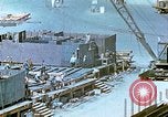 Image of Work being done on inverted deck house section of a Liberty ship  California United States USA, 1942, second 55 stock footage video 65675025793