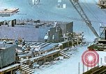 Image of Work being done on inverted deck house section of a Liberty ship  California United States USA, 1942, second 56 stock footage video 65675025793