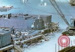 Image of Work being done on inverted deck house section of a Liberty ship  California United States USA, 1942, second 57 stock footage video 65675025793