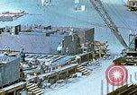 Image of Work being done on inverted deck house section of a Liberty ship  California United States USA, 1942, second 58 stock footage video 65675025793