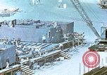 Image of Work being done on inverted deck house section of a Liberty ship  California United States USA, 1942, second 60 stock footage video 65675025793