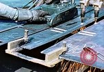 Image of Double torch cutting deck plates for Liberty ship under construction California United States USA, 1942, second 19 stock footage video 65675025804