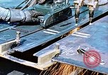 Image of Double torch cutting deck plates for Liberty ship under construction California United States USA, 1942, second 20 stock footage video 65675025804