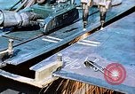 Image of Double torch cutting deck plates for Liberty ship under construction California United States USA, 1942, second 22 stock footage video 65675025804
