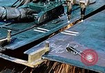Image of Double torch cutting deck plates for Liberty ship under construction California United States USA, 1942, second 26 stock footage video 65675025804