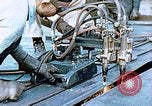 Image of Double torch cutting deck plates for Liberty ship under construction California United States USA, 1942, second 27 stock footage video 65675025804