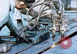 Image of Double torch cutting deck plates for Liberty ship under construction California United States USA, 1942, second 28 stock footage video 65675025804