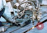 Image of Double torch cutting deck plates for Liberty ship under construction California United States USA, 1942, second 30 stock footage video 65675025804