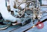 Image of Double torch cutting deck plates for Liberty ship under construction California United States USA, 1942, second 33 stock footage video 65675025804