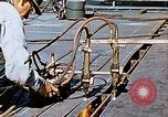 Image of Double torch cutting deck plates for Liberty ship under construction California United States USA, 1942, second 52 stock footage video 65675025804