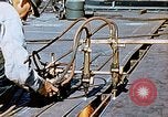 Image of Double torch cutting deck plates for Liberty ship under construction California United States USA, 1942, second 53 stock footage video 65675025804