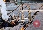Image of Double torch cutting deck plates for Liberty ship under construction California United States USA, 1942, second 54 stock footage video 65675025804