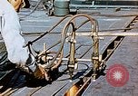 Image of Double torch cutting deck plates for Liberty ship under construction California United States USA, 1942, second 55 stock footage video 65675025804