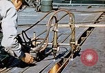Image of Double torch cutting deck plates for Liberty ship under construction California United States USA, 1942, second 60 stock footage video 65675025804